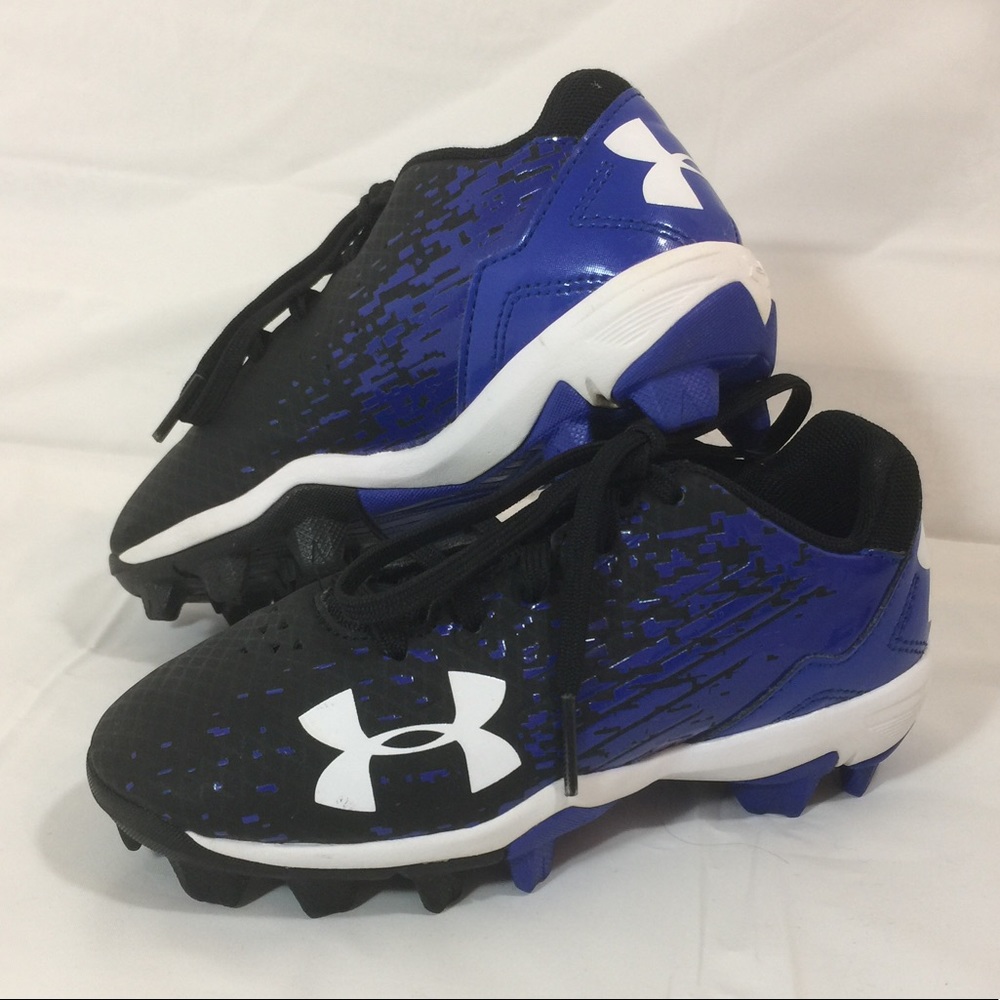 Baseball shoes and two baseball pants.